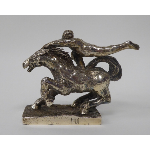 256 - A series of three, solid silver models, depicting acrobatic horsemen, each set on a rectangular plin... 