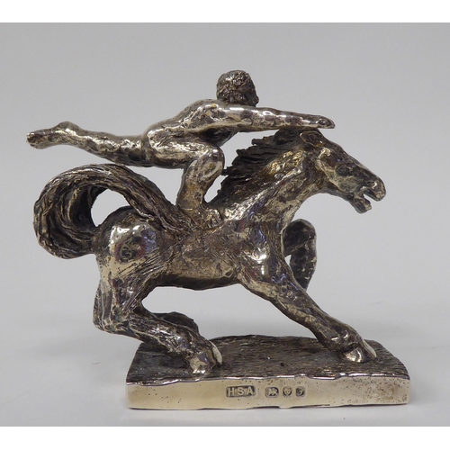 256 - A series of three, solid silver models, depicting acrobatic horsemen, each set on a rectangular plin... 