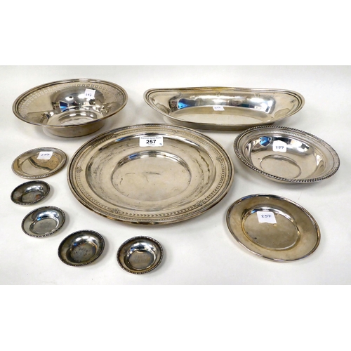 257 - Nine various items of Sterling silver tableware: to include an oval bread basket  12