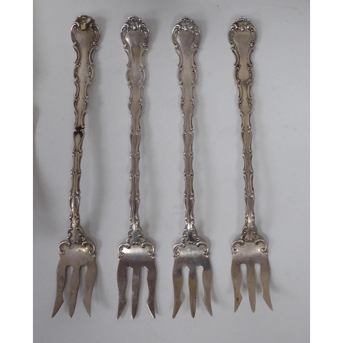 258 - Various Sterling silver flatware: to include a pair of serving tongs, spoons and forks  (combin... 