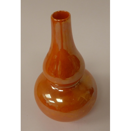 26 - A Royal Doulton orange lustre glazed double gourd shape vase  bears a printed mark  6