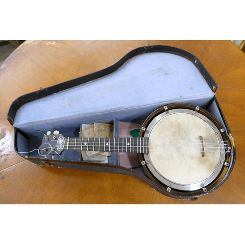 262 - A Savana four string banjo  cased