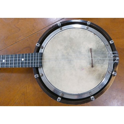 262 - A Savana four string banjo  cased