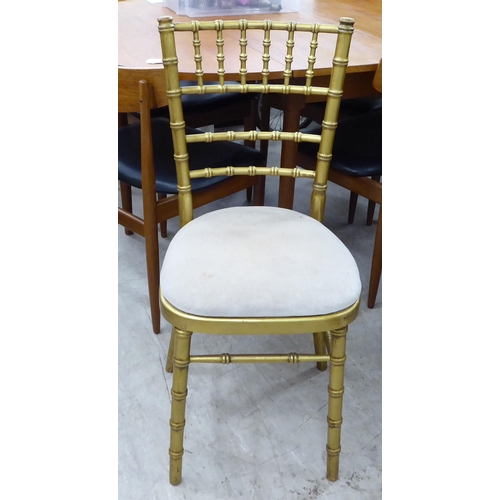 269 - A gilt sprayed, bamboo effect bedroom chair with a mushroom coloured upholstered seat