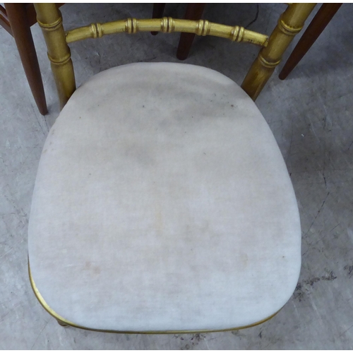 269 - A gilt sprayed, bamboo effect bedroom chair with a mushroom coloured upholstered seat