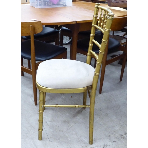 269 - A gilt sprayed, bamboo effect bedroom chair with a mushroom coloured upholstered seat