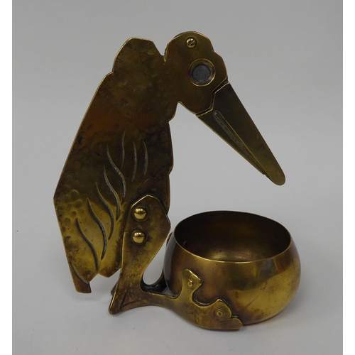 27 - An early 20thC Eingtr Schotzm Ges Gesch brass novelty cigar cutter and ashtray, fashioned as a bird,... 