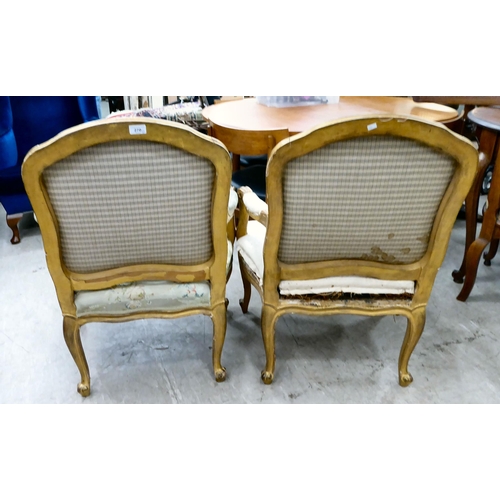 270 - A pair of late 19thC French gilded pine, showwood framed, open arm salon chairs, raised on cabriole ... 