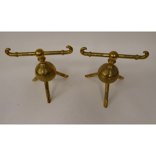 31 - A pair of late Victorian brass hearth implement racks, on decoratively turned, tripod legs  7