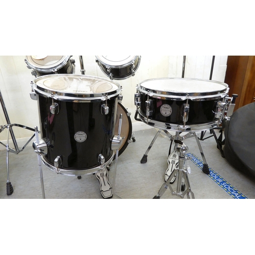 394 - A Mapex eight piece drum set 