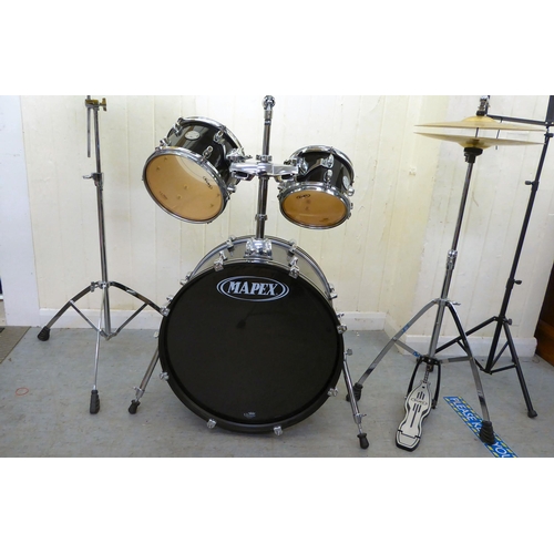 394 - A Mapex eight piece drum set 