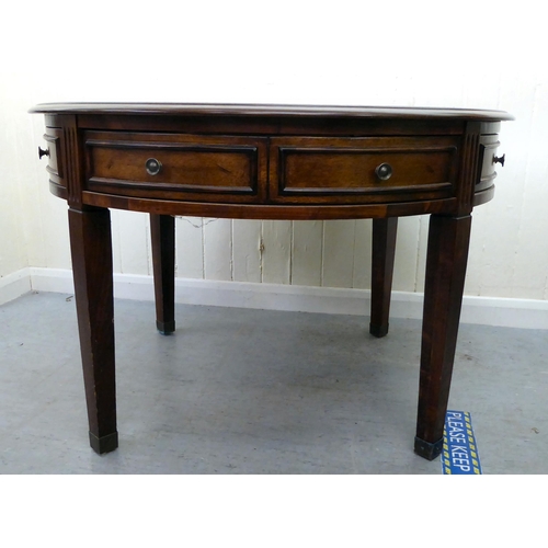 396 - A modern mahogany finished coffee table with four frieze drawers, raised on square, tapered legs&nbs... 