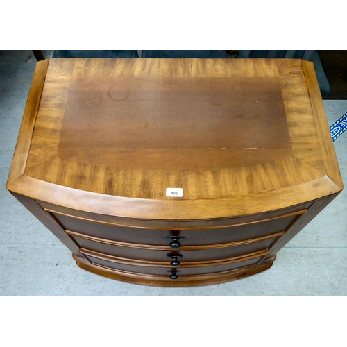 405 - A modern mahogany finished bowfront, three drawer dressing chest, on a plinth  32