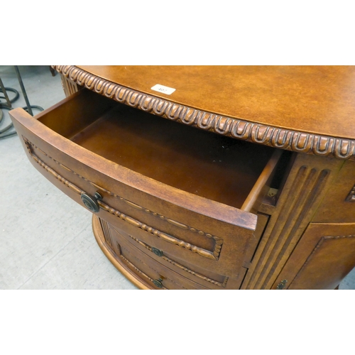 407 - A modern walnut finished bowfront sideboard with four drawers/two doors, on a plinth  32