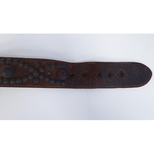 45 - A late 19th/early 20thC stitched brown hide, buckled dog collar with decorative studwork and a brass... 