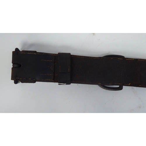 45 - A late 19th/early 20thC stitched brown hide, buckled dog collar with decorative studwork and a brass... 