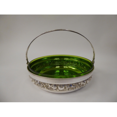 47 - An early 19thC WMF electroplated fruit dish and semi-opaque green glass liner, decorated with a frie... 