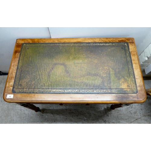 48 - A mid Victorian mahogany writing table with two side drawers, raised on reeded, tapered legs and cas... 