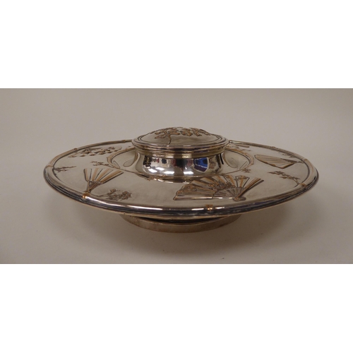 5 - A late Victorian Elkington & Co silver plated inkwell, the cut glass reservoir set in a saucer b... 