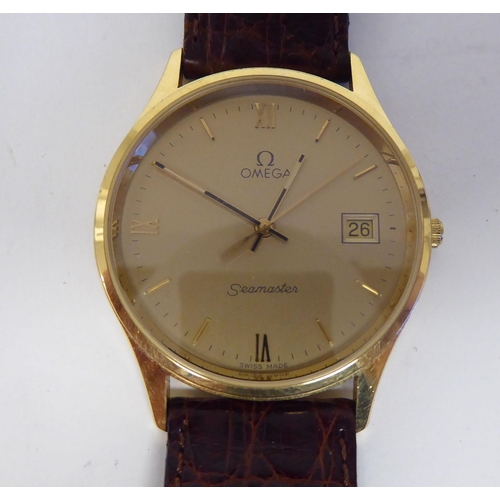 50 - An Omega Seamaster 9ct gold cased wristwatch, faced by a gilded baton and Roman dial, seconds hand a... 