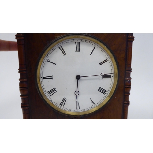 53 - A late 19thC walnut veneered cased mantel timepiece with turned, flank pilasters and a fretworked ga... 