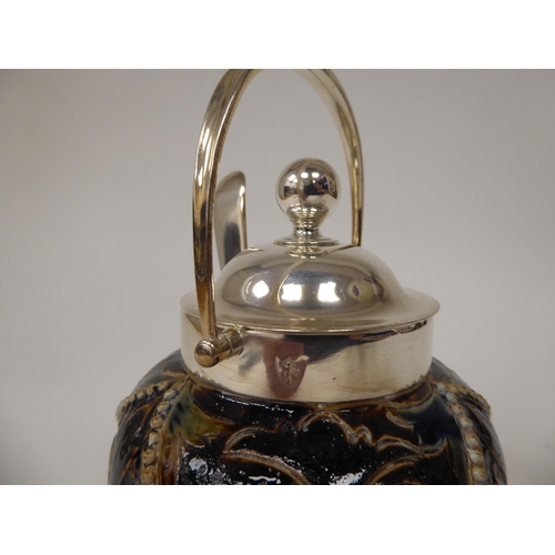 64 - A Doulton Lambeth stoneware conserve pot of bulbous form with a silver plated collar, swing handle, ... 