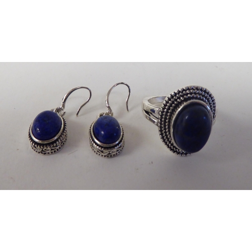 65 - A modern lapis lazuli coloured suite of jewellery, viz. a triple row necklace, a bracelet, ring and ... 