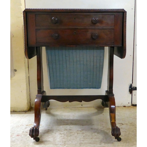 66 - A Regency rosewood combination writing/sewing table with two drawers, over a deep fabric covered dra... 