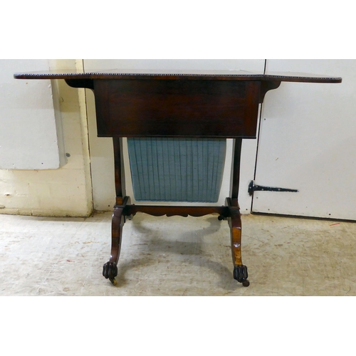 66 - A Regency rosewood combination writing/sewing table with two drawers, over a deep fabric covered dra... 