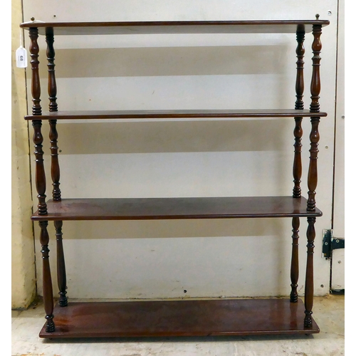 68 - An early 20thC mahogany four tier hanging display shelf  28