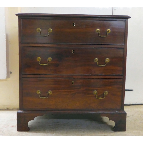 72 - A George III mahogany three drawer dressing chest, raised on bracket feet  29