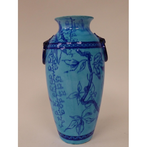 77 - A late 19thC Minton's china vase of baluster form, decorated in tones of blue with opposing, moulded... 