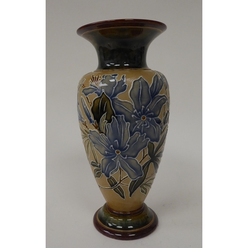 79 - .An early 20thC Doulton Lambeth stoneware vase of shouldered baluster form with a flared neck and de... 