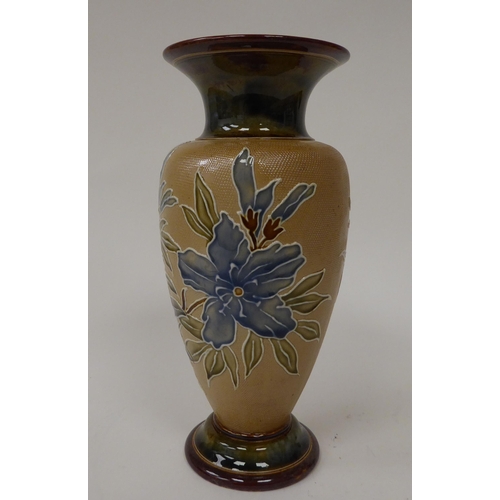 79 - .An early 20thC Doulton Lambeth stoneware vase of shouldered baluster form with a flared neck and de... 