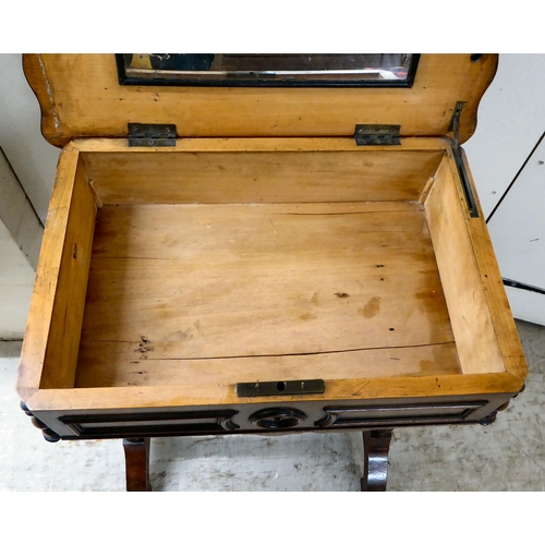 8 - A late Victorian mahogany work table with a serpentine outlined, hinged lid, over reeded pillar supp... 