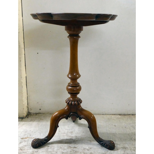 80 - A late Victorian walnut and mahogany pedestal table, raised on a tripod base  25.5