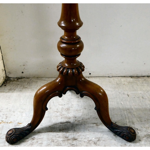 80 - A late Victorian walnut and mahogany pedestal table, raised on a tripod base  25.5