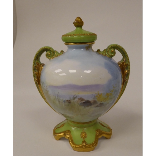 83 - A Royal Doulton gilded and lime green china twin handled bottle vase of spherical form with a stoppe... 