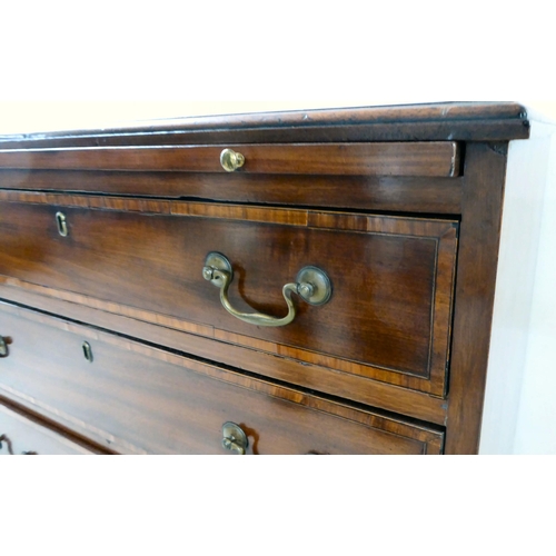 84 - A George III mahogany bachelor's chest with a brushing slide, over four graduated drawers, raised on... 