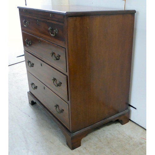 84 - A George III mahogany bachelor's chest with a brushing slide, over four graduated drawers, raised on... 