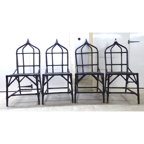 90 - A set of four 20thC black painted, bamboo effect and caned bound conservatory chairs