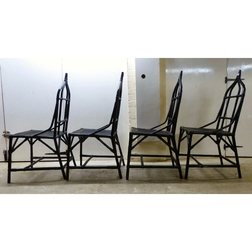 90 - A set of four 20thC black painted, bamboo effect and caned bound conservatory chairs