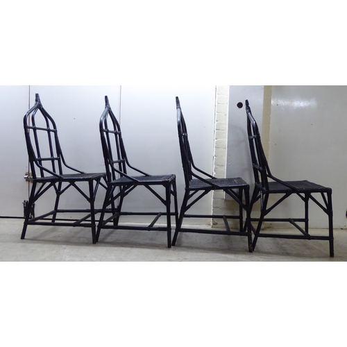 90 - A set of four 20thC black painted, bamboo effect and caned bound conservatory chairs