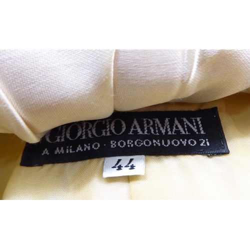 264 - Ladies fashion items: to include a Chanel skirt; and another by Giorgio Armani  size 44