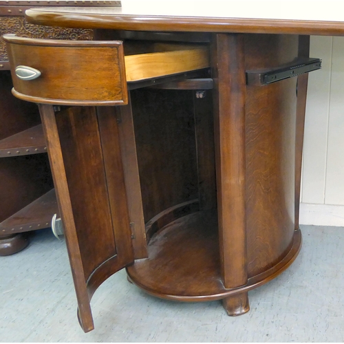 398 - A modern mahogany finished kidney shaped desk with twin pedestal, one with a drawer, the other, a dr... 