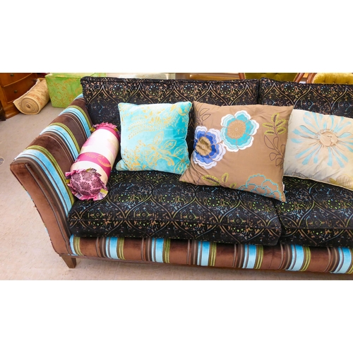 415 - A modern multi-coloured fabric upholstered four person settee with various scatter cushions  96... 