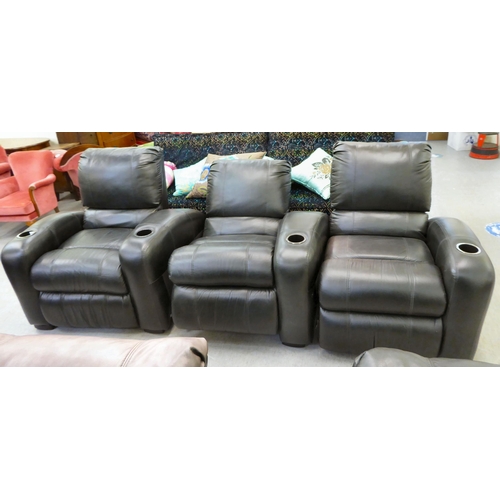 417 - A row of three brown hide upholstered manual reclining cinema chair with cup holders to each arm&nbs... 