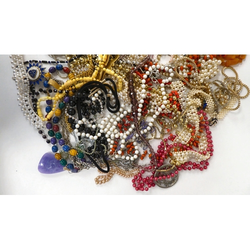 22 - Costume jewellery: to include simulated amber coloured bead necklaces; assorted pendants; brooches; ... 