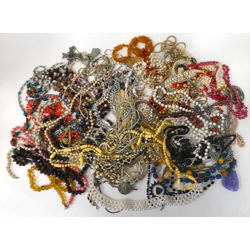 22 - Costume jewellery: to include simulated amber coloured bead necklaces; assorted pendants; brooches; ... 