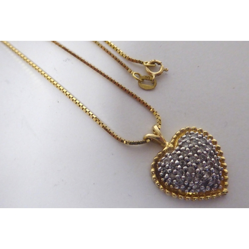 281 - A 14ct gold, diamond set, heart shape pendant, on a fine 18ct gold box link neckchain and ring bolt ... 